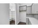 Walk-in pantry with ample shelving for storage, located adjacent to the kitchen at 9936 E Revolution Dr, Mesa, AZ 85212