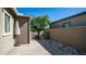 Private patio area with pavers and a gate leading to the community at 9936 E Revolution Dr, Mesa, AZ 85212
