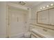 Well-maintained bathroom features a shower-tub combination and a vanity with a sink and mirrored cabinet at 10020 W Royal Oak Rd # F, Sun City, AZ 85351