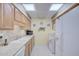 Well-maintained kitchen with white appliances and ample counter space at 10020 W Royal Oak Rd # F, Sun City, AZ 85351