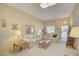 Cozy living room featuring neutral paint, carpet and comfortable seating arrangement at 10020 W Royal Oak Rd # F, Sun City, AZ 85351