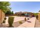 Spacious backyard featuring a tennis court, basketball hoop, and seating area perfect for outdoor activities at 10402 E Starion Ave, Mesa, AZ 85212