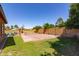 Spacious backyard featuring a sports court, patio area, and lush landscaping, ideal for outdoor activities at 10402 E Starion Ave, Mesa, AZ 85212