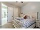 Inviting bedroom with a comfy queen bed, dresser, and open door, creating a welcoming atmosphere at 10402 E Starion Ave, Mesa, AZ 85212