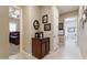 Inviting hallway with decorative furnishings, connecting to the bedroom and laundry areas at 10402 E Starion Ave, Mesa, AZ 85212
