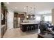 Open-concept kitchen with granite countertops, stainless steel appliances, and a spacious island at 10402 E Starion Ave, Mesa, AZ 85212