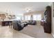 Open living area with a large seating area, kitchen, and plenty of natural light at 10402 E Starion Ave, Mesa, AZ 85212