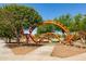 Community playground with unique climbing structures and safe play surfaces, designed for enjoyment at 10402 E Starion Ave, Mesa, AZ 85212