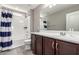 Well-lit bathroom features a shower-tub combination and updated vanity at 11127 E Tripoli Ave, Mesa, AZ 85212