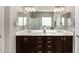 Bathroom showcasing a double sink vanity with a large mirror and ample counter space at 11127 E Tripoli Ave, Mesa, AZ 85212