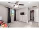 Bedroom with ceiling fan, tv, and closet at 11127 E Tripoli Ave, Mesa, AZ 85212