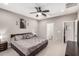 Spacious bedroom with a ceiling fan, carpet flooring and a view to the bathroom at 11127 E Tripoli Ave, Mesa, AZ 85212