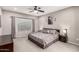 Cozy bedroom with a queen bed, soft carpet, neutral paint, and dark wood furniture, creating a relaxing atmosphere at 11127 E Tripoli Ave, Mesa, AZ 85212