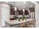 Modern kitchen with stainless steel appliances, granite countertops, an island with seating and ample cabinetry at 11127 E Tripoli Ave, Mesa, AZ 85212