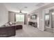 A living room features a large sectional sofa and a ceiling fan at 11127 E Tripoli Ave, Mesa, AZ 85212