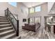 Spacious living room with high ceilings, large windows, modern decor, and stylish hardwood flooring at 11127 E Tripoli Ave, Mesa, AZ 85212