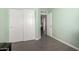 Bedroom featuring sliding closet doors and a view into another room at 11473 W Austin Thomas Dr, Surprise, AZ 85378