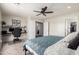 Well-lit bedroom featuring a built-in desk and a view into the closet at 11473 W Austin Thomas Dr, Surprise, AZ 85378