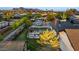 Aerial view of a large backyard with patio furniture, lush lawn, and desert landscaping at 11530 E Vine Ave, Mesa, AZ 85208