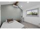 Bright bedroom featuring a modern AC unit, vaulted ceilings, and luxury vinyl plank flooring at 11530 E Vine Ave, Mesa, AZ 85208