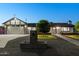 Charming single-story home featuring manicured front yard and modern architectural design at 11530 E Vine Ave, Mesa, AZ 85208