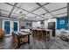 Open concept kitchen featuring an island with bar seating and stainless steel appliances at 11530 E Vine Ave, Mesa, AZ 85208