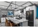 Contemporary kitchen boasts granite counters, white cabinets, black hardware and patterned backsplash at 11530 E Vine Ave, Mesa, AZ 85208