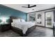 Spacious main bedroom with hardwood floors, ample closet space, and natural light at 11530 E Vine Ave, Mesa, AZ 85208