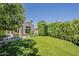 Lush backyard with a meticulously manicured lawn and attractive vegetation in raised planters at 11675 E Caron St, Scottsdale, AZ 85259