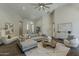 Spacious living area with stylish decor, vaulted ceiling, and an abundance of natural light at 11675 E Caron St, Scottsdale, AZ 85259