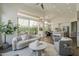 Open-concept living space with modern furnishings, connecting to a well-appointed kitchen at 11675 E Caron St, Scottsdale, AZ 85259