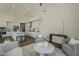Bright and airy living space featuring stylish seating and seamless transition to the kitchen at 11675 E Caron St, Scottsdale, AZ 85259