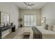 Tranquil primary bedroom with modern furnishings, elegant decor, and large windows at 11675 E Caron St, Scottsdale, AZ 85259