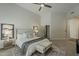 Spacious primary bedroom featuring a plush bed, stylish decor, and ample natural light at 11675 E Caron St, Scottsdale, AZ 85259
