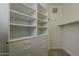 Spacious walk-in closet with built-in shelving and drawers for optimal organization and storage at 11675 E Caron St, Scottsdale, AZ 85259