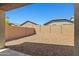 The expansive backyard showcases low-maintenance landscaping and privacy walls at 12416 W Midway Ave, Glendale, AZ 85307