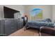 Bright bedroom featuring natural light, a large dresser, and carpeting at 12416 W Midway Ave, Glendale, AZ 85307