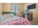 Bright bedroom featuring a large window, vanity, TV, and comfortable decor at 12416 W Midway Ave, Glendale, AZ 85307