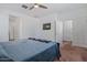 Spacious bedroom with carpeting, ceiling fan, and natural light at 12416 W Midway Ave, Glendale, AZ 85307