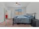 Bedroom featuring carpeted floors, a window with blinds, and simple decor at 12416 W Midway Ave, Glendale, AZ 85307