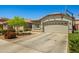 Charming single-story home with a two-car garage and basketball hoop at 12416 W Midway Ave, Glendale, AZ 85307