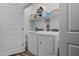 Modern laundry room featuring washer, dryer, and storage space at 12416 W Midway Ave, Glendale, AZ 85307