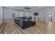 Modern living room with wood floors, comfortable couch, and natural light at 12416 W Midway Ave, Glendale, AZ 85307