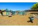 Community playground featuring slides, swings, and climbing structures for enjoyment at 12416 W Midway Ave, Glendale, AZ 85307
