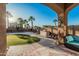 Relaxing backyard oasis with covered patio, BBQ area, and sparkling pool at 13446 S 186Th Ave, Goodyear, AZ 85338
