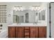 Spacious bathroom featuring dual vanities, framed mirrors, and modern lighting at 13446 S 186Th Ave, Goodyear, AZ 85338