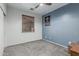 A spacious bedroom featuring a neutral palette, ceiling fan, and natural light at 13446 S 186Th Ave, Goodyear, AZ 85338