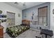 This bedroom features a wood bed, two windows, and memorabilia adorning the walls at 13446 S 186Th Ave, Goodyear, AZ 85338
