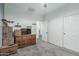 Cozy bedroom showcasing neutral walls, carpet, a wood dresser, and access to a hallway at 13446 S 186Th Ave, Goodyear, AZ 85338