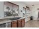 Charming kitchen features a sink, granite counters, and window with wood blinds at 13446 S 186Th Ave, Goodyear, AZ 85338